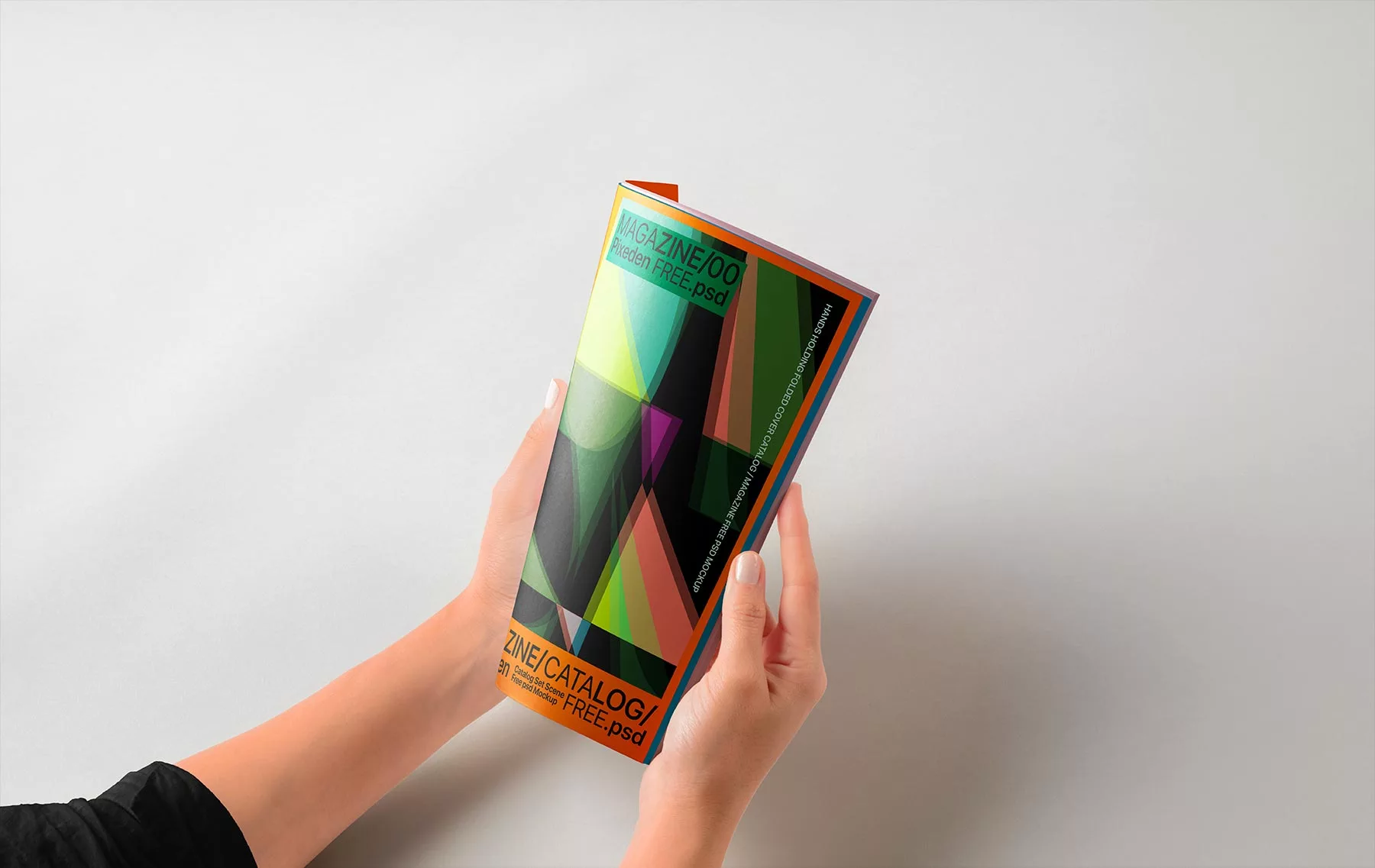 Hands Holding Folded Magazine Mockup