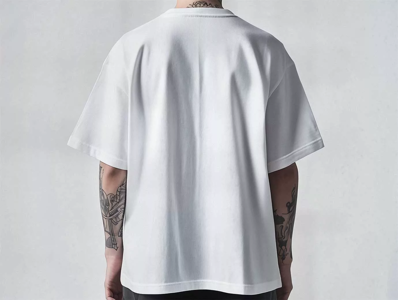 Free Oversized T-Shirt Mockup – Back View on Tattooed Man