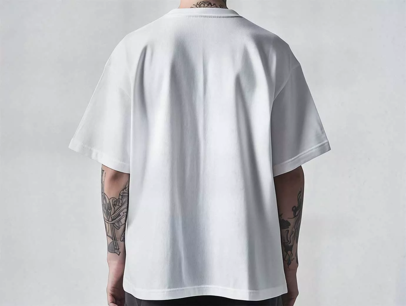 Free Oversized T-Shirt Mockup – Back View on Tattooed Man