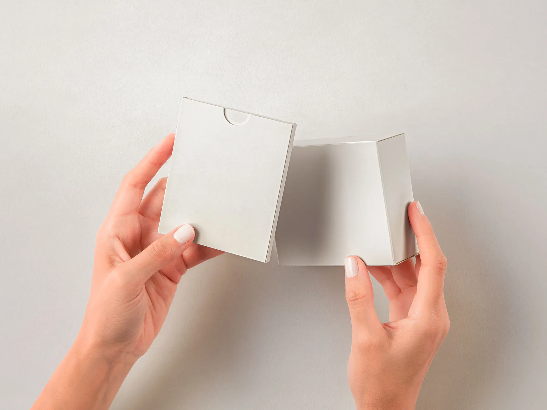 Hands Holding Product Boxes Mockup