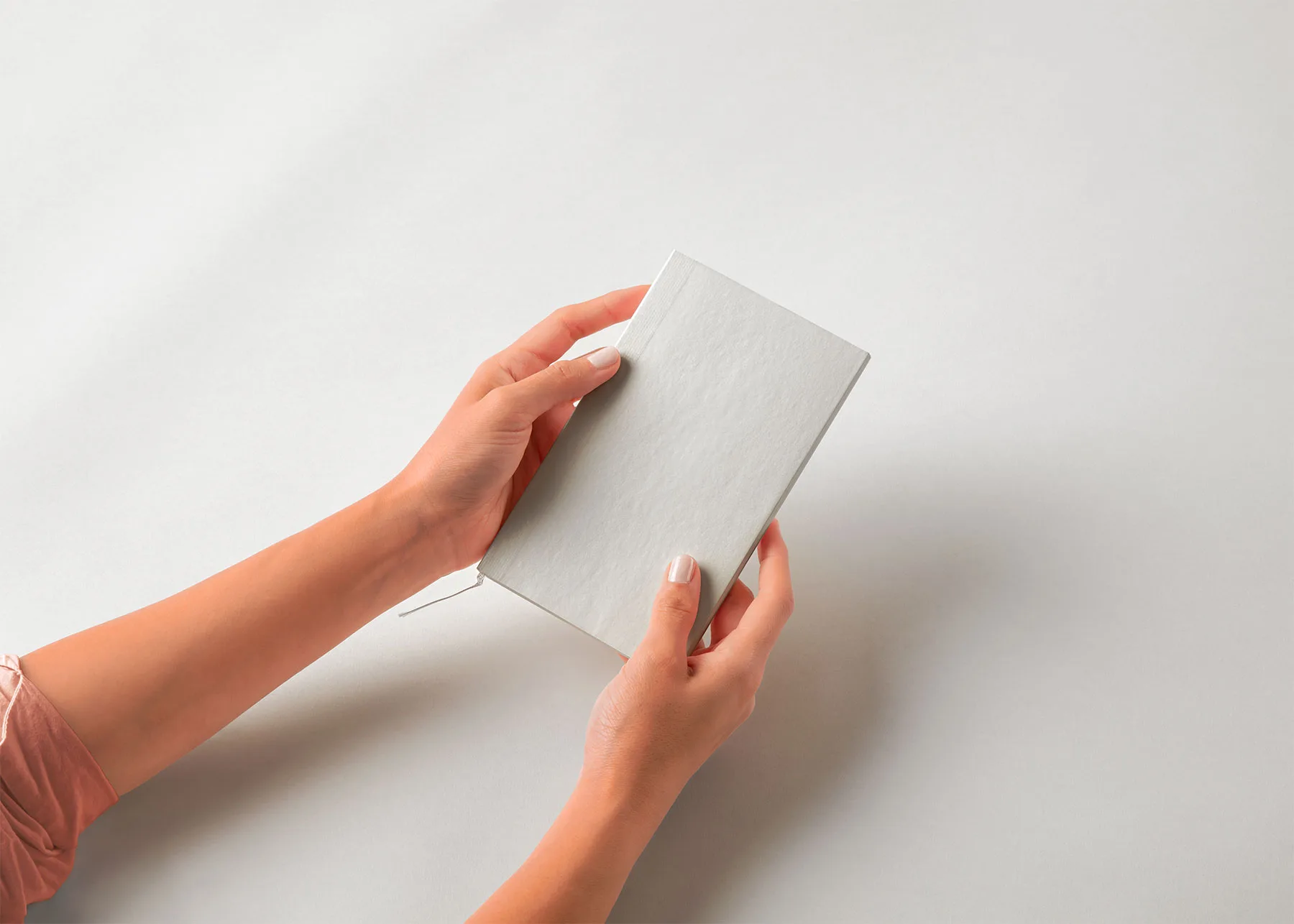 Pocket-Size Notebook Mockup in Hands