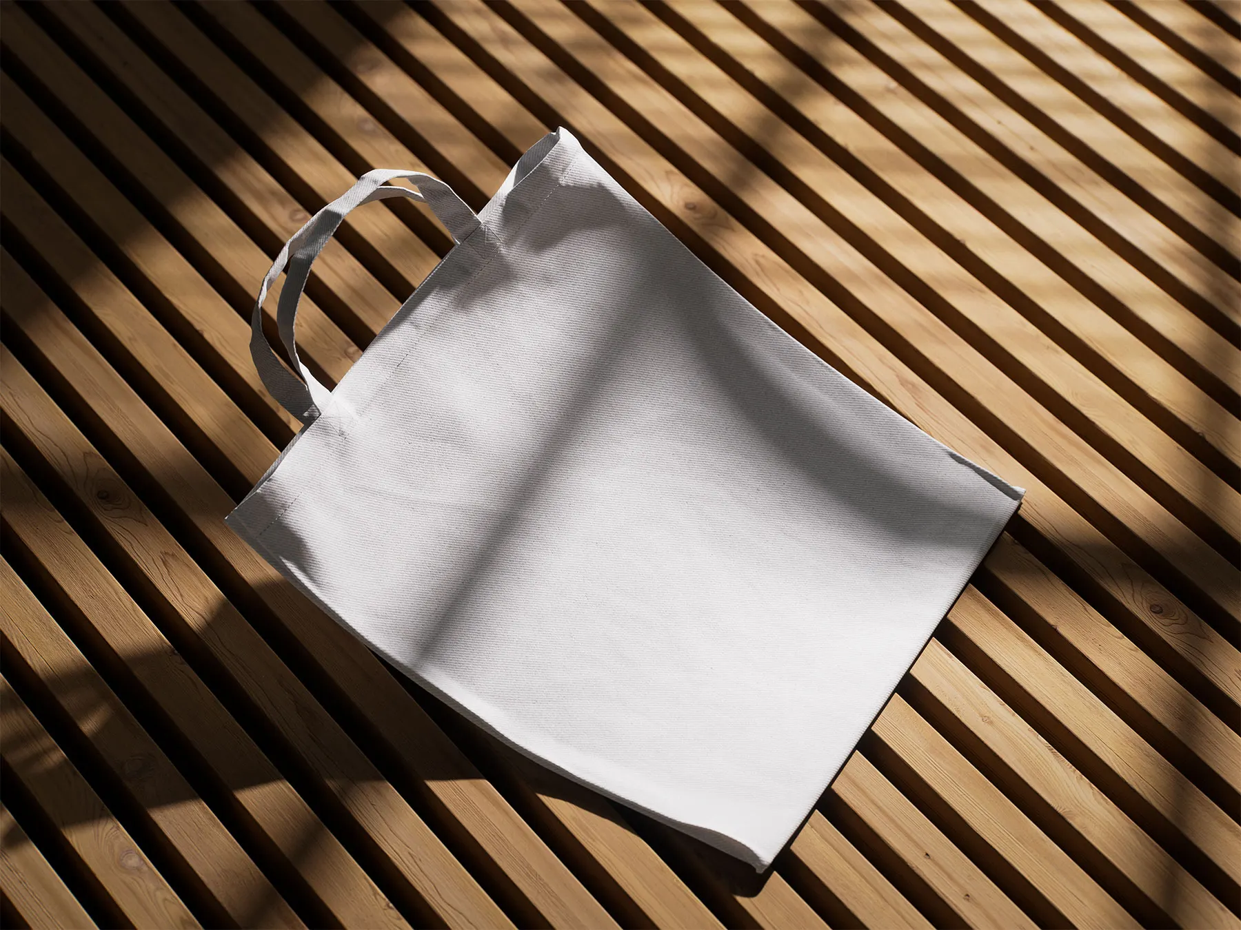 Tote Bag Mockup Set on Wooden Surface