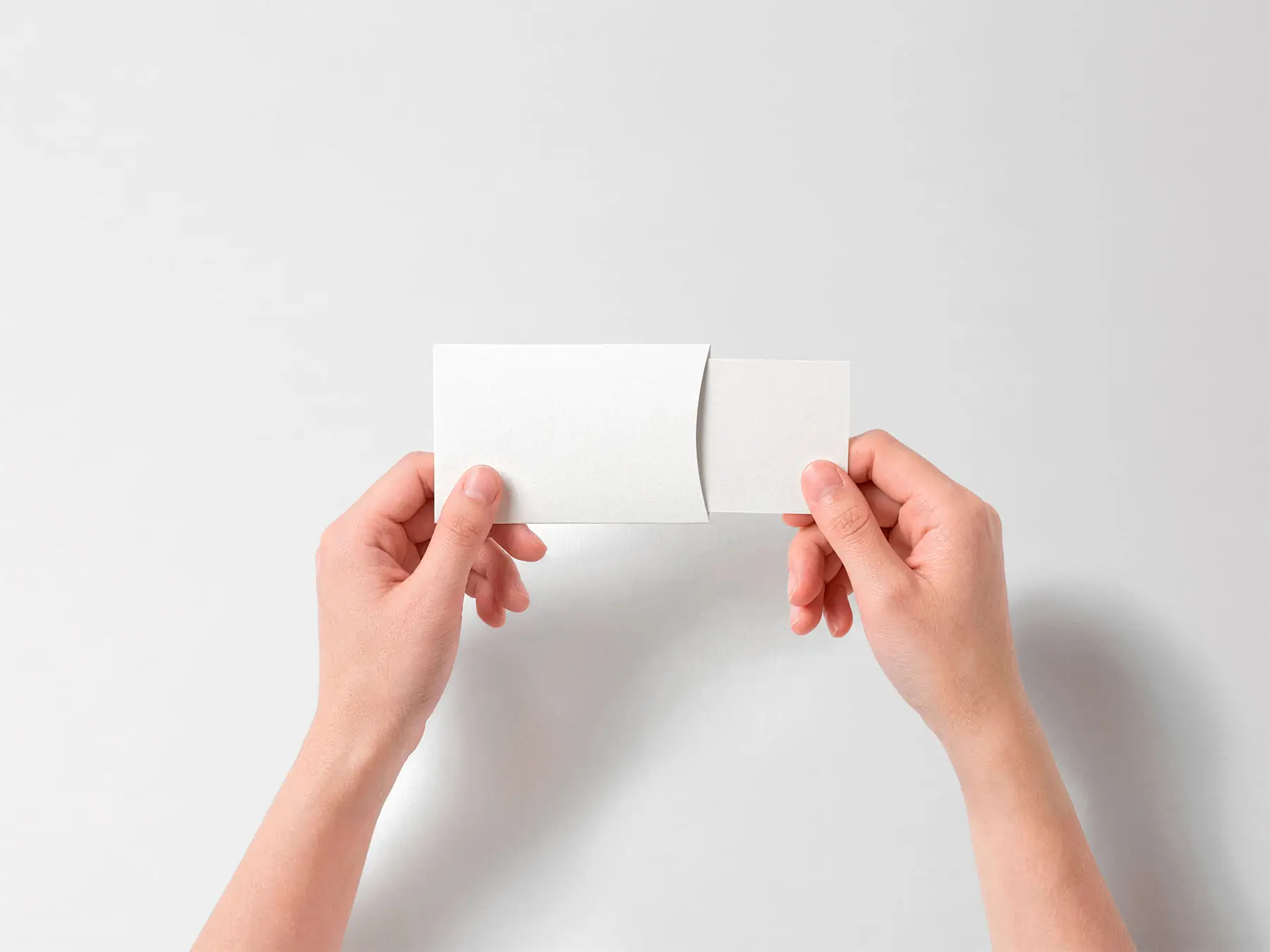 Business Card Mockup in Hands with Sliding Sleeve