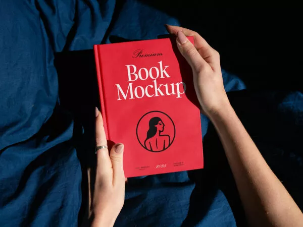 Free Hardcover Book Mockup held in Hands