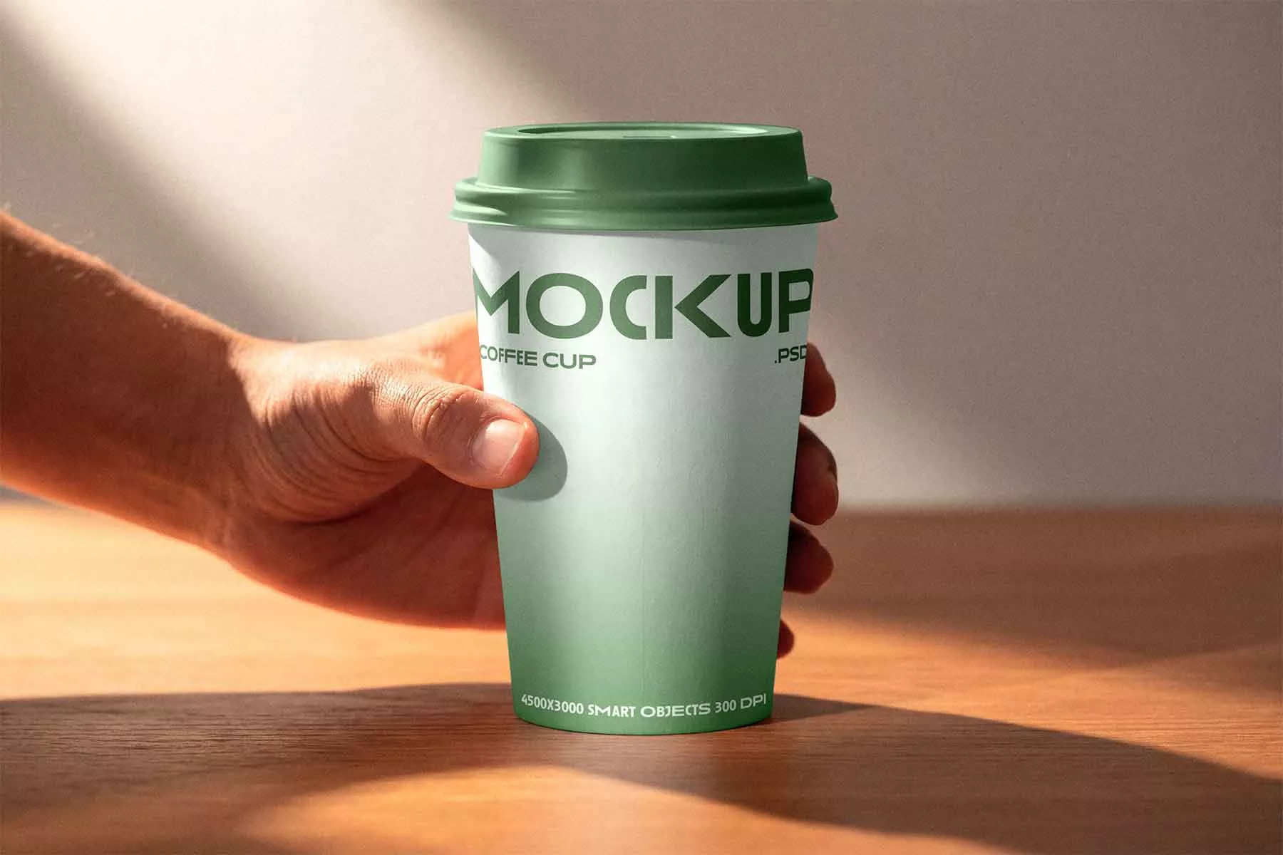 Coffee Cup in Hand Mockup (Free Download)