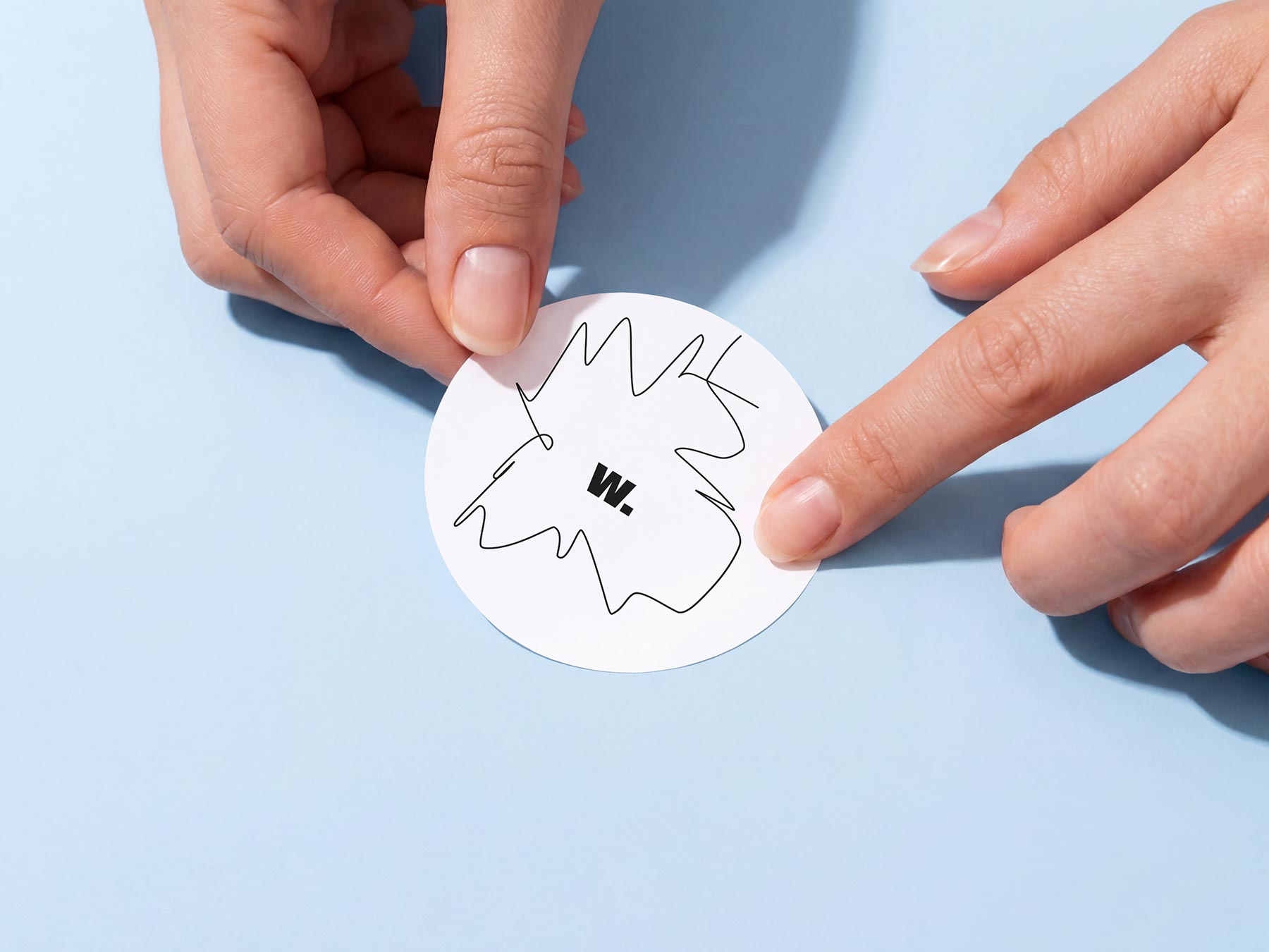 Free Round Sticker in Hands Mockup (PSD Download)