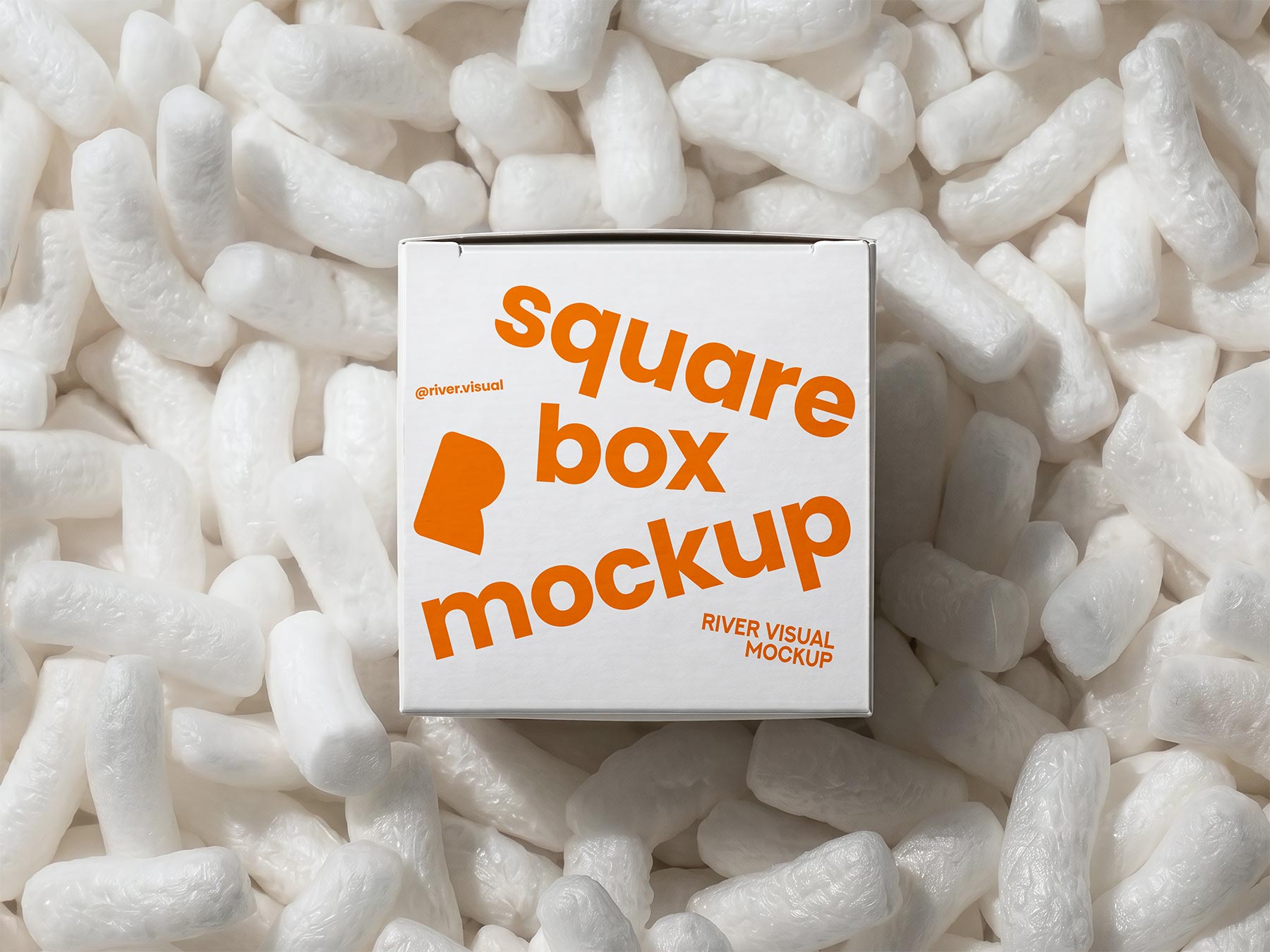 Free Square Shipping Box Mockup in Packing Peanuts