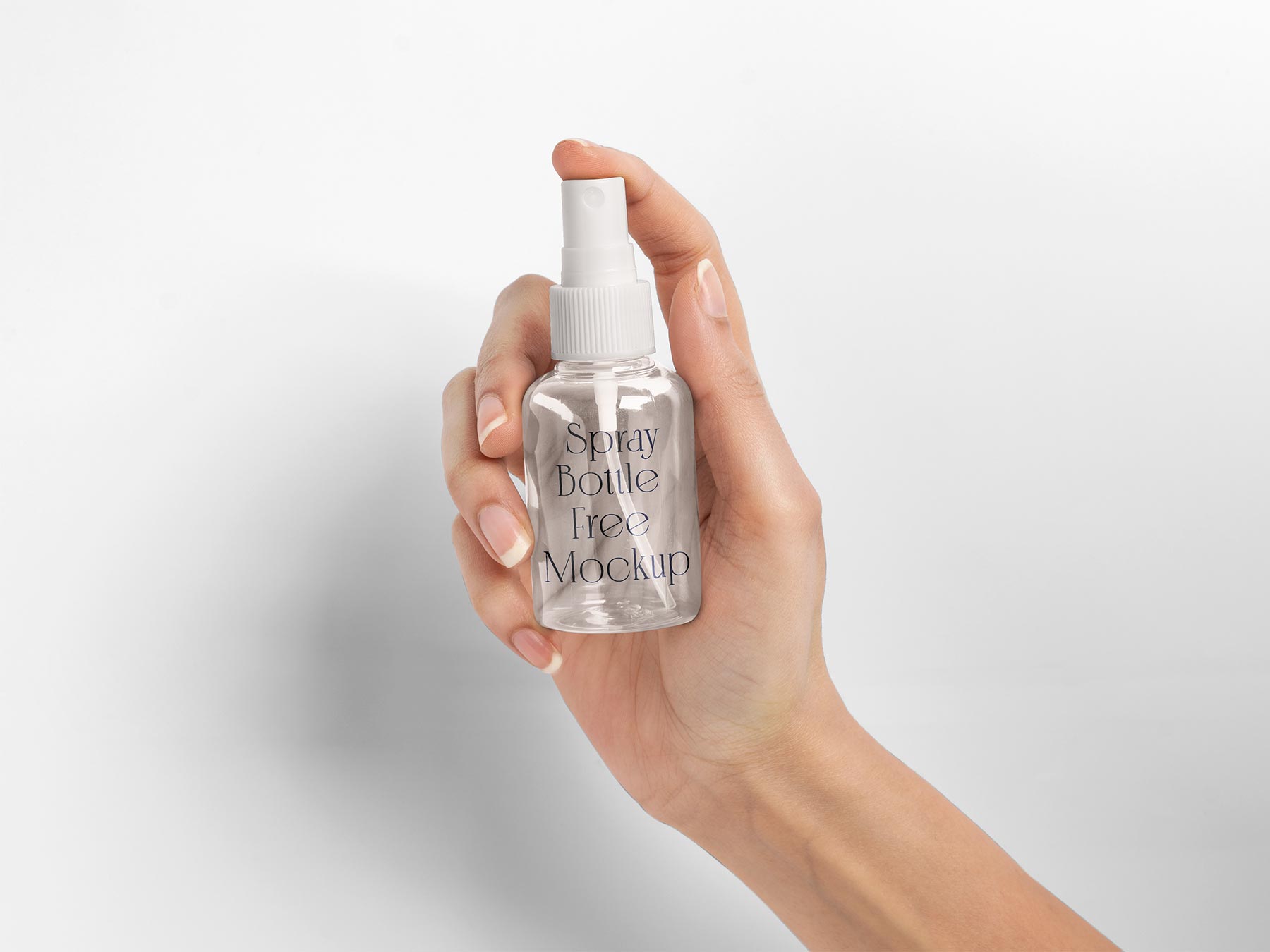 Hand Holding Clear Spray Bottle Free Mockup