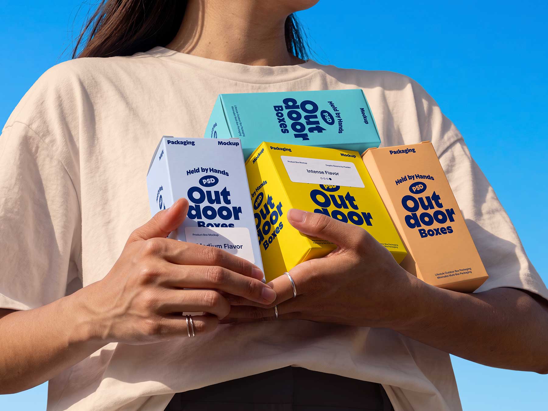 Person Holding Multiple Product Boxes Free Mockup