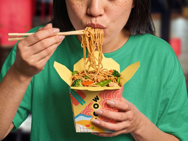 Free Chinese Noodle Box Mockup Held by Person