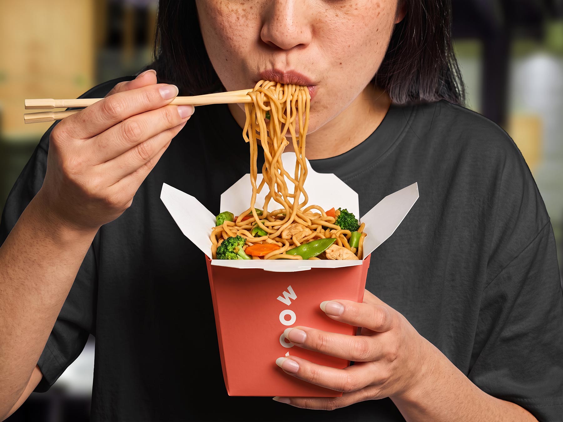 Free Chinese Noodle Box Mockup Held by Person