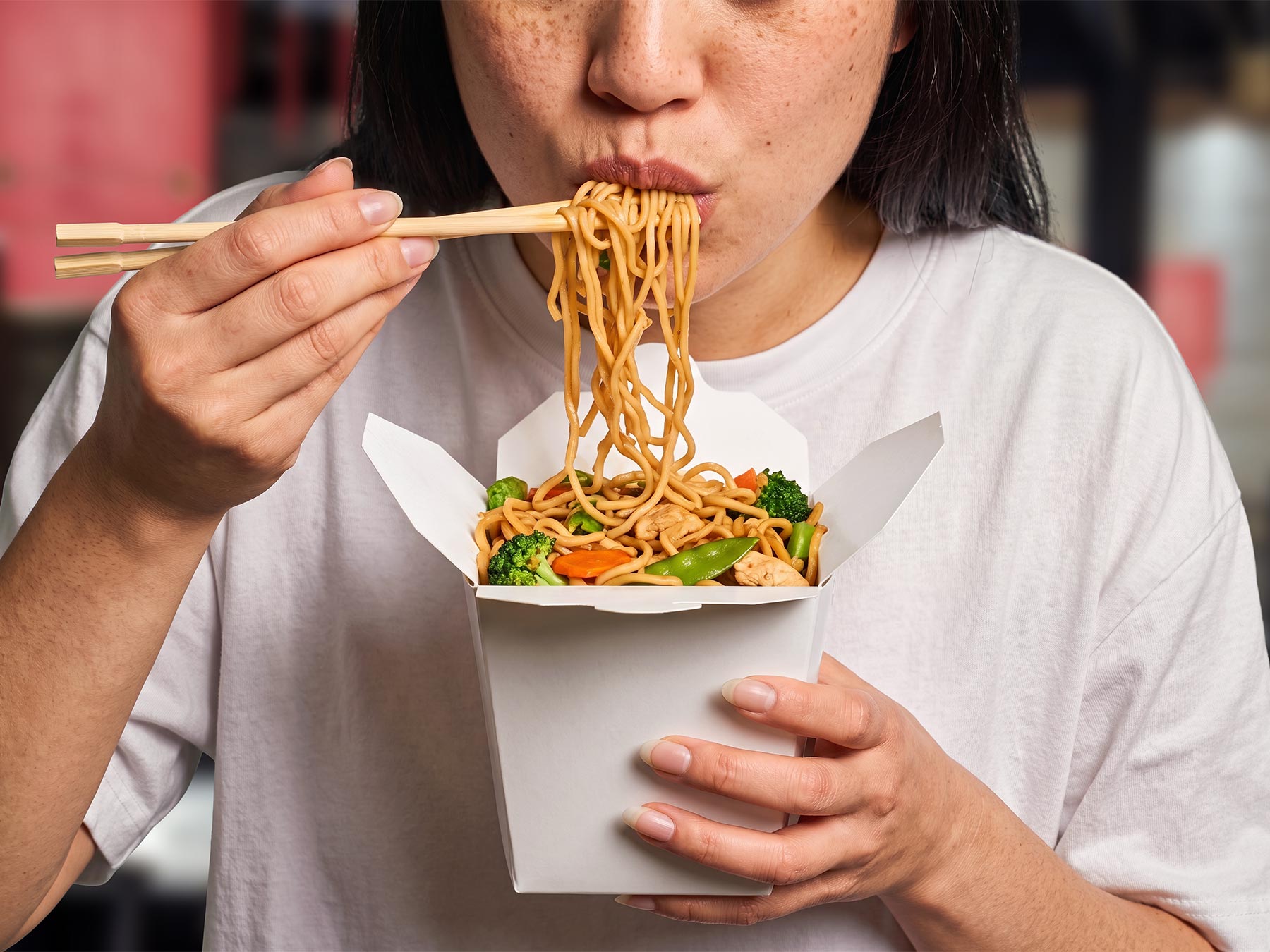 Free Chinese Noodle Box Mockup Held by Person