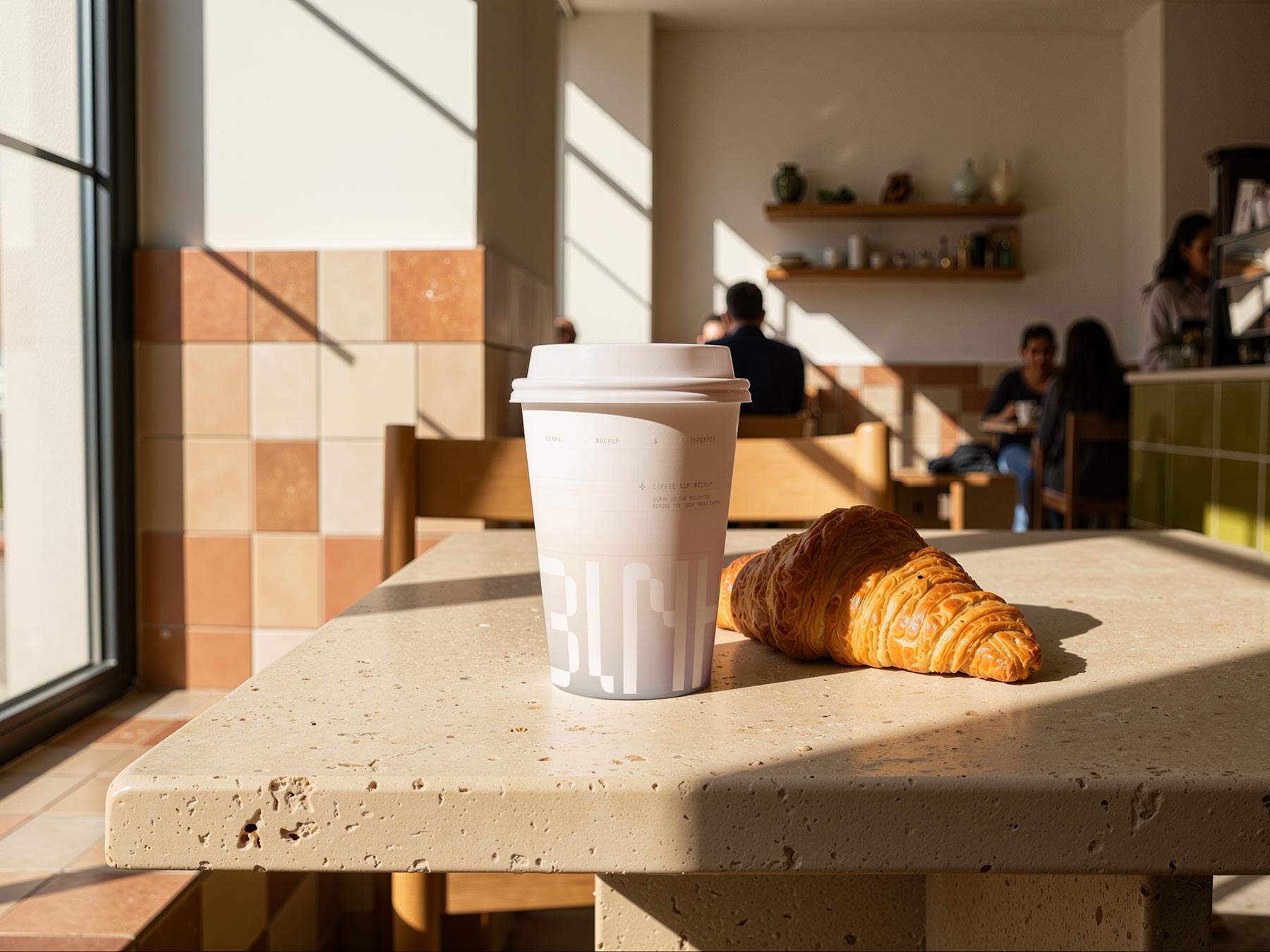 Free Coffee Paper Cup Mockup with Croissant in Café
