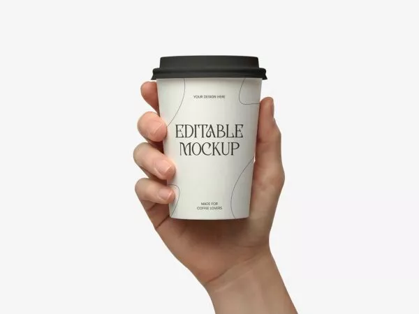 Free Paper Coffee Cup Mockup Held by Hand