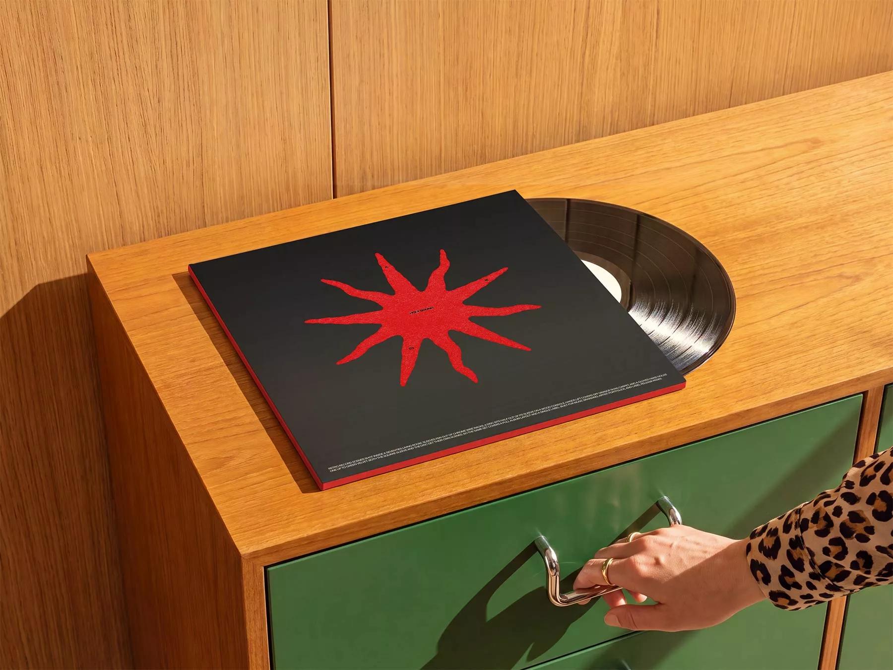 Free Vinyl Record Cover Mockup on Wooden Cabinet