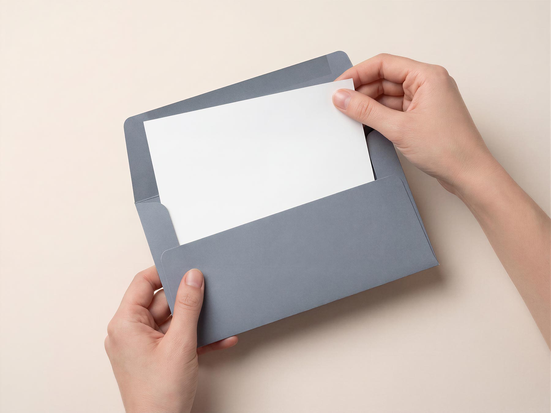Hands Holding Open Envelope with Invitation Card Mockup