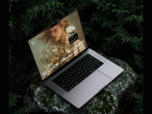 Free MacBook Pro Mockup on Rock in Forest