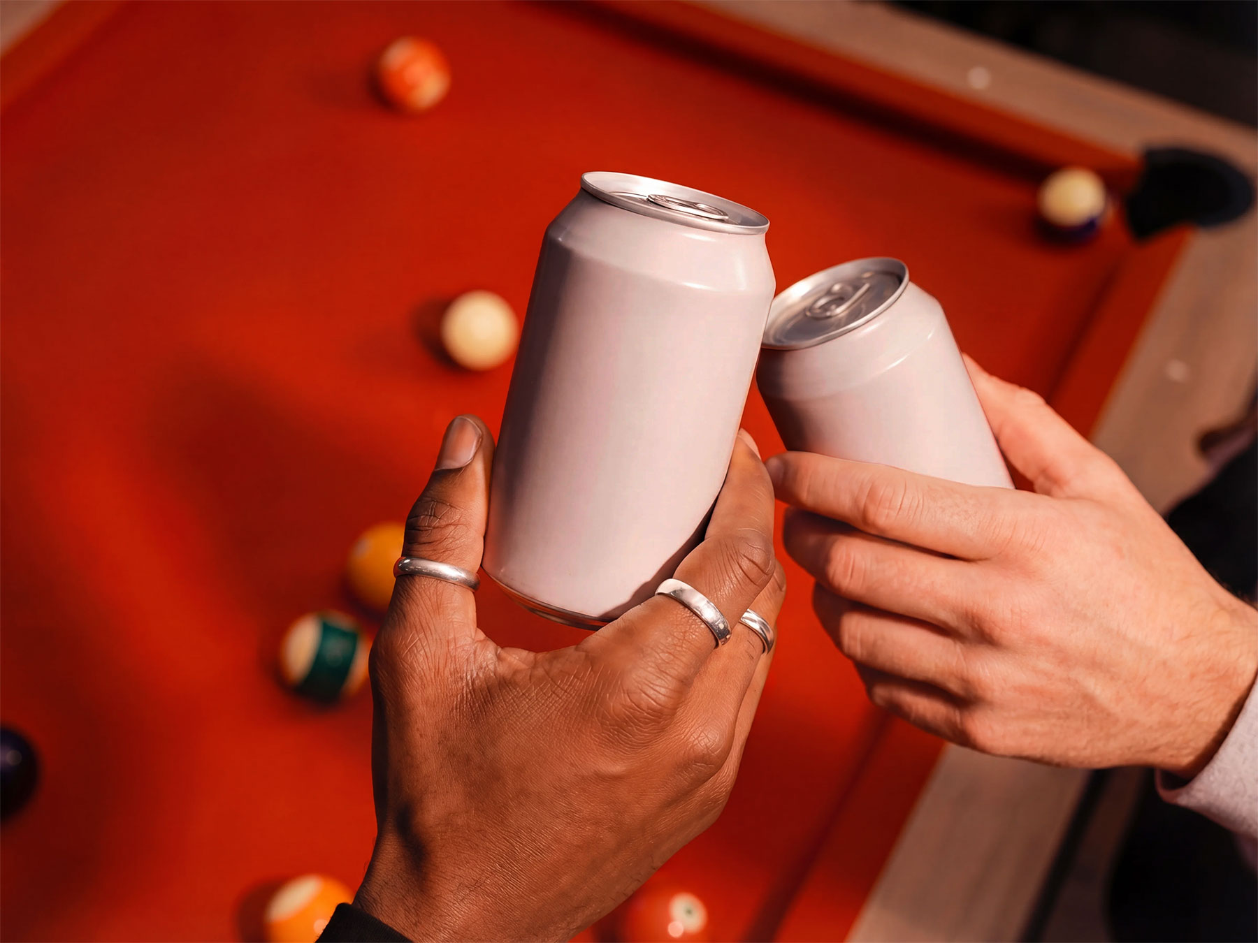 Free Soda Cans Cheers Mockup Held in Hands