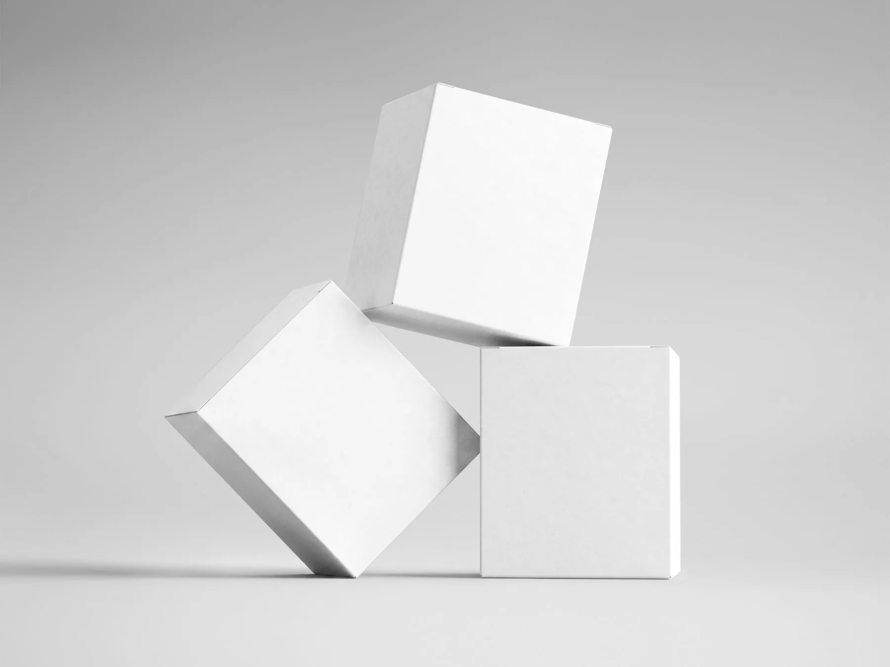 Three Square Packaging Boxes Mockup (Free PSD)